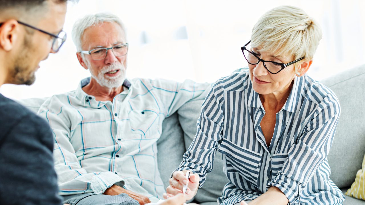Senior couple meeting with financial advisor.