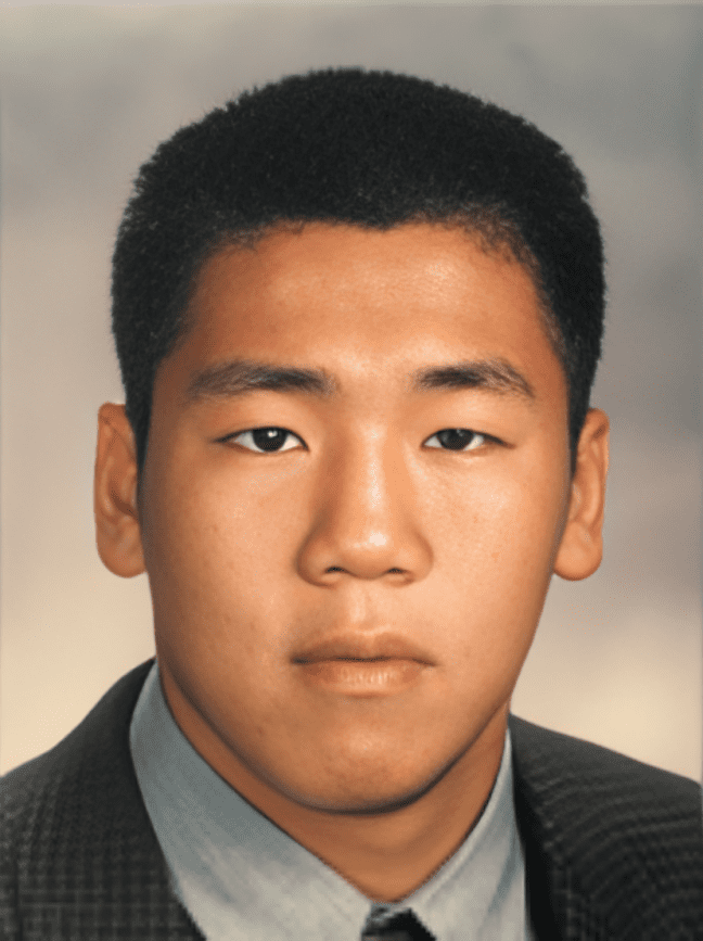 Portrait of a person in formal attire.